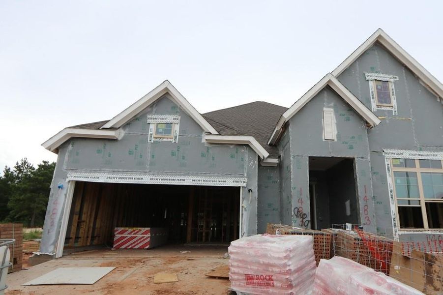 In-progress construction of a new home in Escondido 60' Homesites, Magnolia, TX (Image 24).
