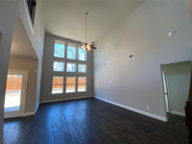 Cathedral ceiling, rich hardwood floors, and a wall of windows looking out to tree-lined private yard! Cathedral ceiling, rich hardwood floors, and a wall of windows looking out to tree-lined private yard!