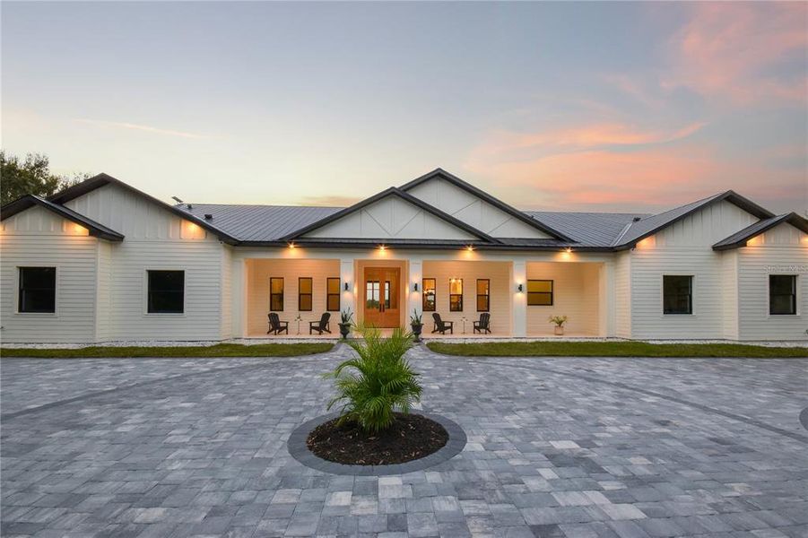 Front exterior of a new home in , Myakka City, FL, highlighting curb appeal (Image 25). Front exterior of a new home in , Myakka City, FL, highlighting curb appeal (Image 25).