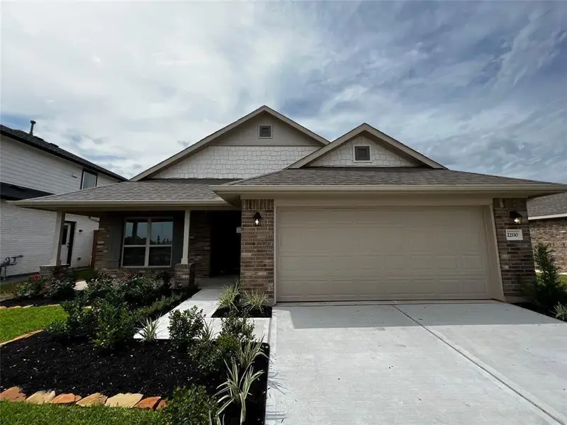 Front exterior of a new home in Kiber Reserve, Angleton, TX, highlighting curb appeal (Image 13).