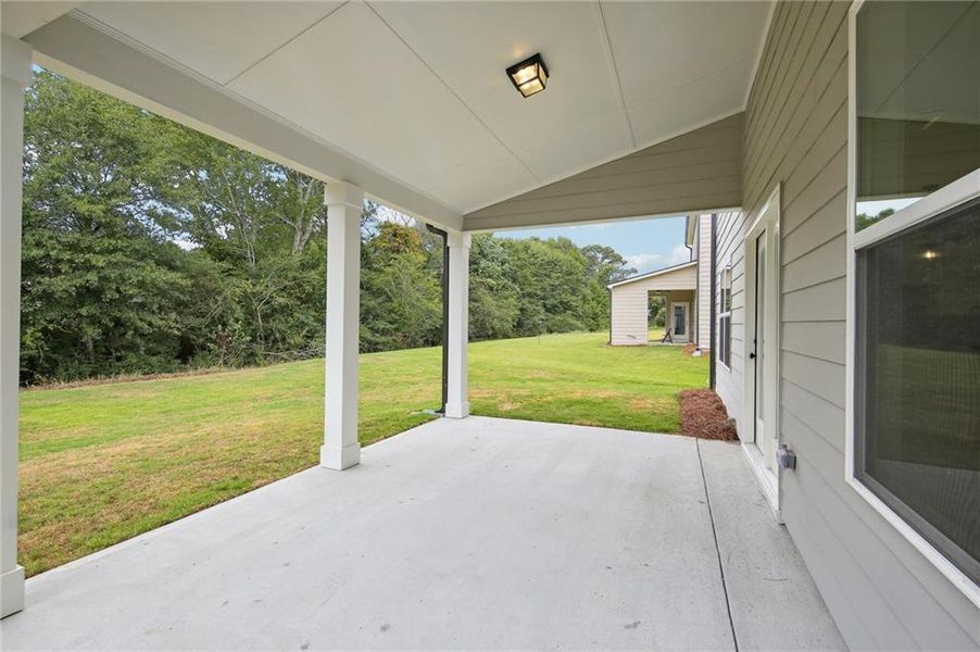 Exterior details and patio area of a home in Rosewood Lake Estates, Hoschton (Image 27).