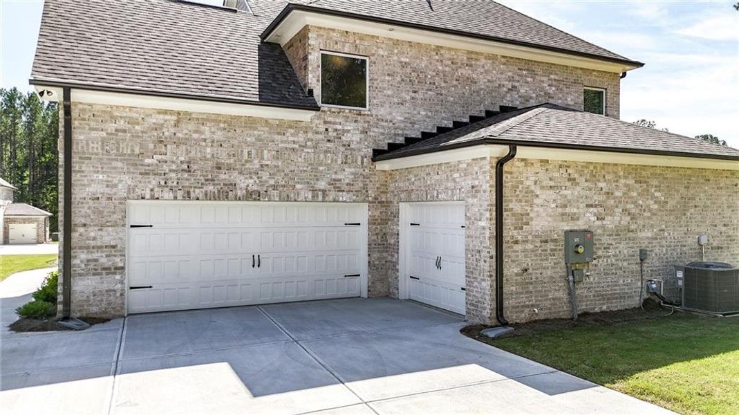 Front exterior of a new home in , Ellenwood, GA, highlighting curb appeal (Image 30).
