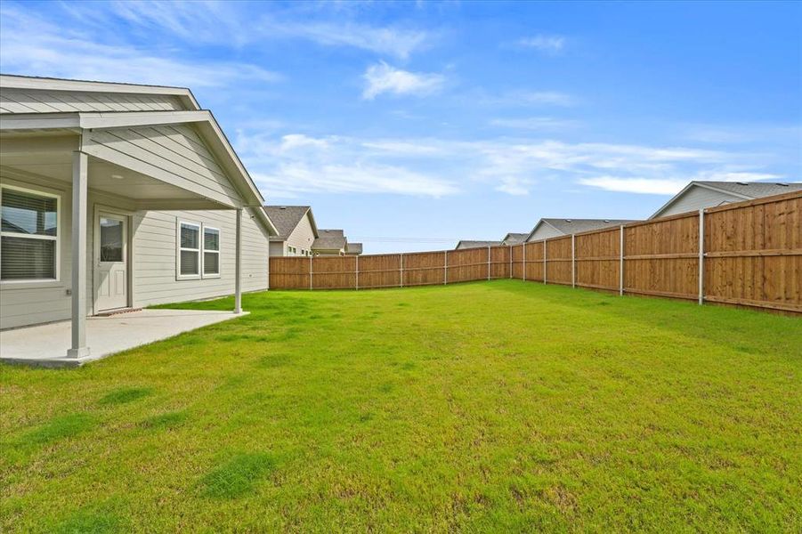 View of yard with a patio area