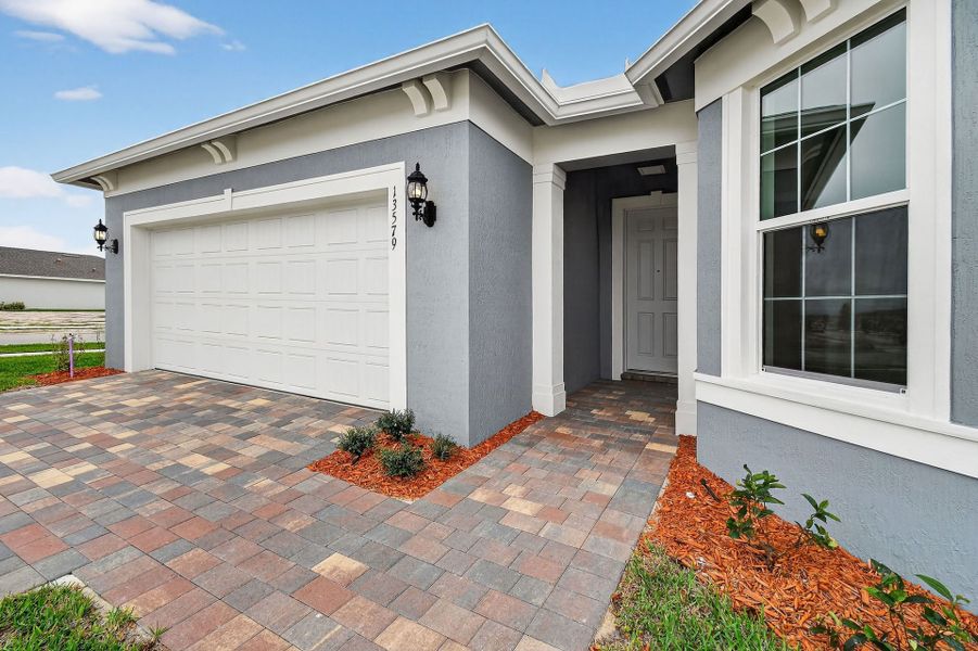 Exterior details and patio area of a home in Del Webb Tradition, Port St. Lucie (Image 33).