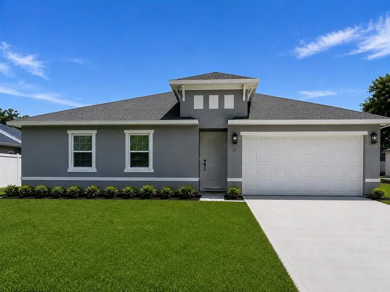 Front exterior of a new home in , Palm Coast, FL, highlighting curb appeal (Image 1). Front exterior of a new home in , Palm Coast, FL, highlighting curb appeal (Image 1).
