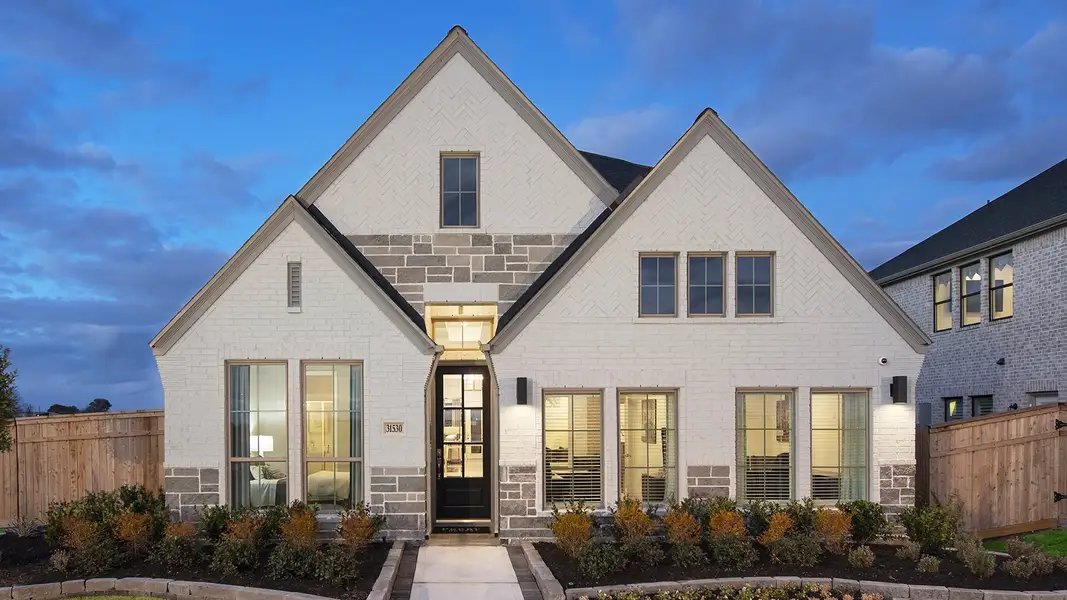 Front exterior of a new home in Briggs Ranch, San Antonio, TX, highlighting curb appeal (Image 2). Front exterior of a new home in Briggs Ranch, San Antonio, TX, highlighting curb appeal (Image 2).