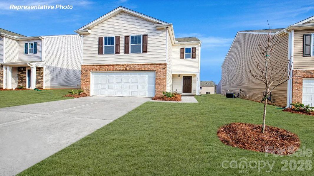 Front exterior of a new home in Woodhaven at Chester, Chester, SC, highlighting curb appeal (Image 1). Front exterior of a new home in Woodhaven at Chester, Chester, SC, highlighting curb appeal (Image 1).