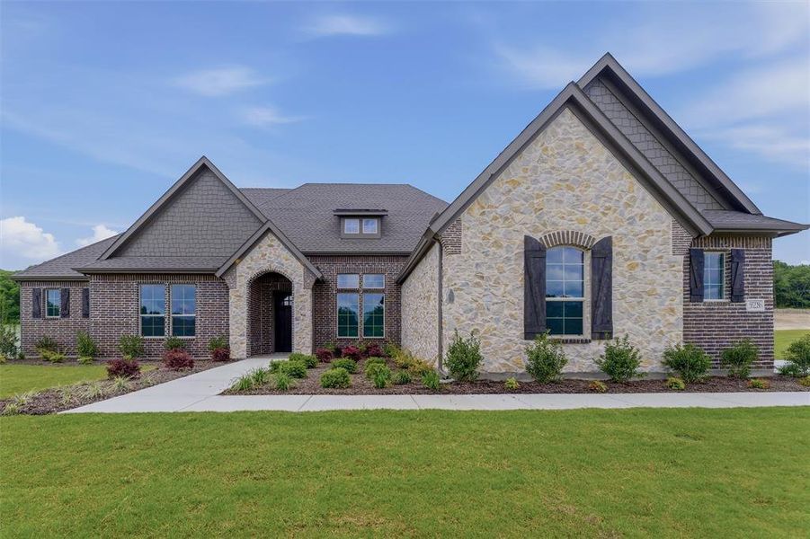 Stone and brick exterior with dark wood shutters and gabled rooflines