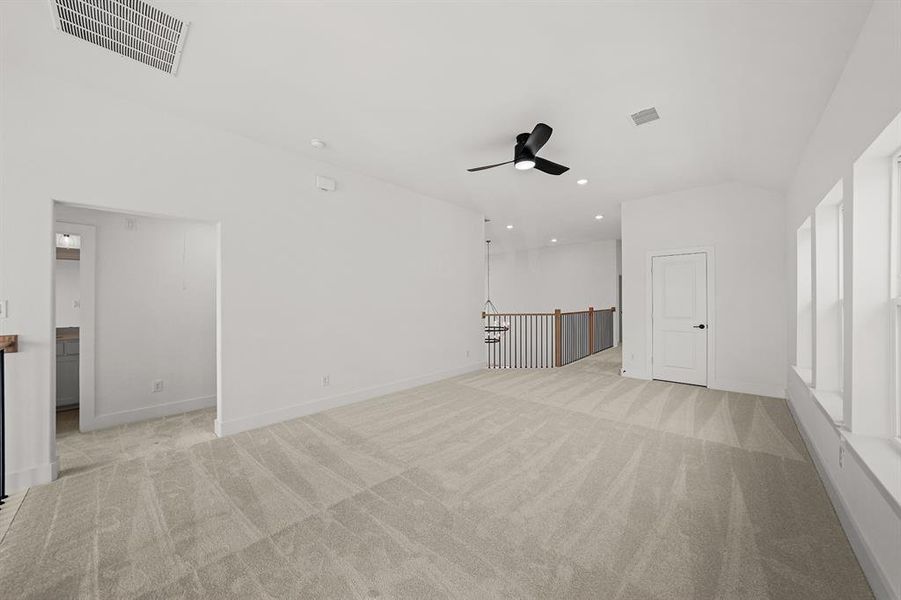 Empty room featuring light carpet, recessed lighting, and ceiling fan