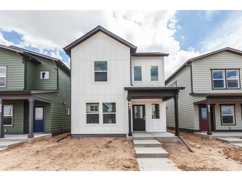Front exterior of a new home in Prairie Song Cottages, Windsor, CO, highlighting curb appeal (Image 29). Front exterior of a new home in Prairie Song Cottages, Windsor, CO, highlighting curb appeal (Image 29).
