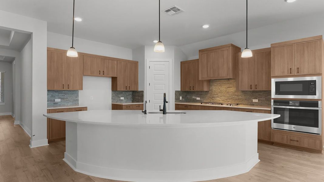 Representative furnished interior of a home built from the Mariah by Chesmar Homes in Newhaven, Manor (Image 4).