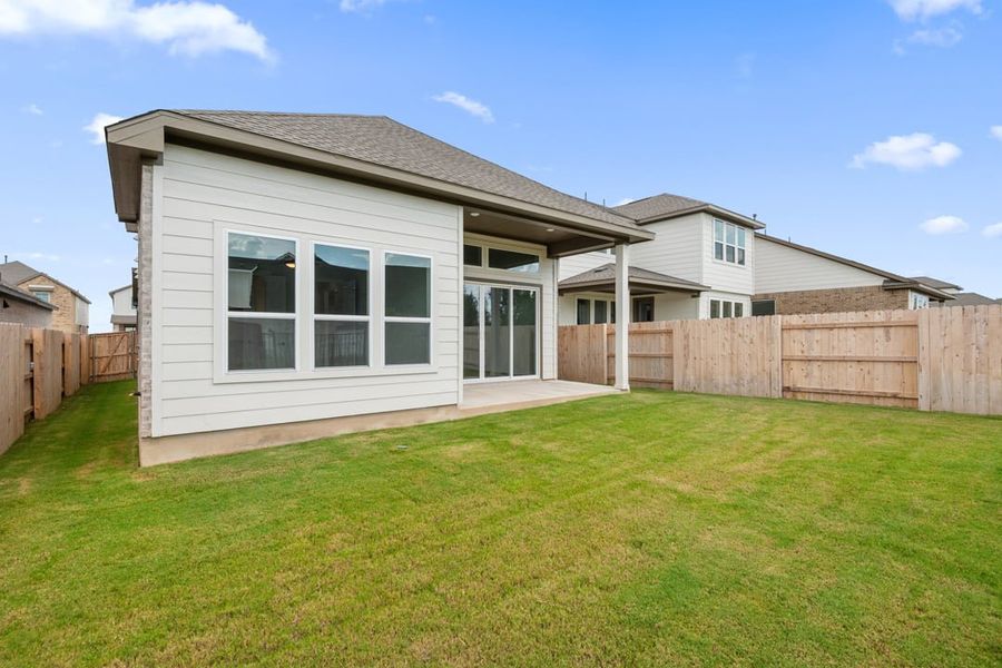 Front exterior of a new home in Terrace Collection at Lariat, Liberty Hill, TX, highlighting curb appeal (Image 30). Front exterior of a new home in Terrace Collection at Lariat, Liberty Hill, TX, highlighting curb appeal (Image 30).