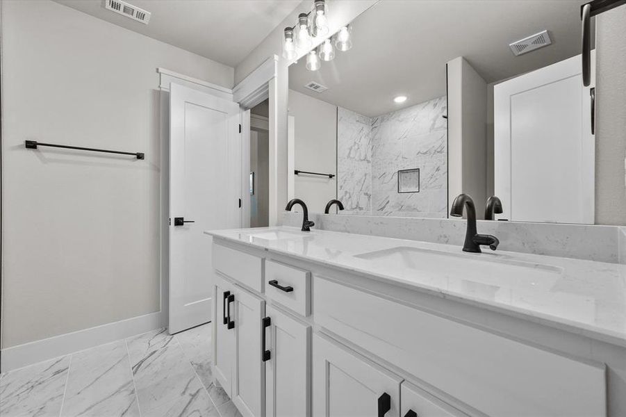 Large secondary bathroom with quartz counter tops!