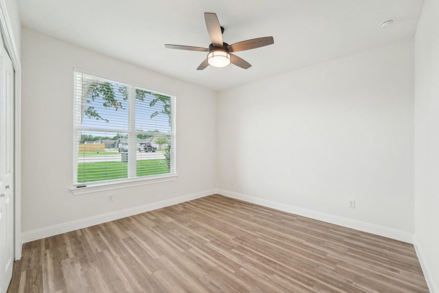 Bedroom with baseboards, and ceiling fan Bedroom with baseboards, and ceiling fan