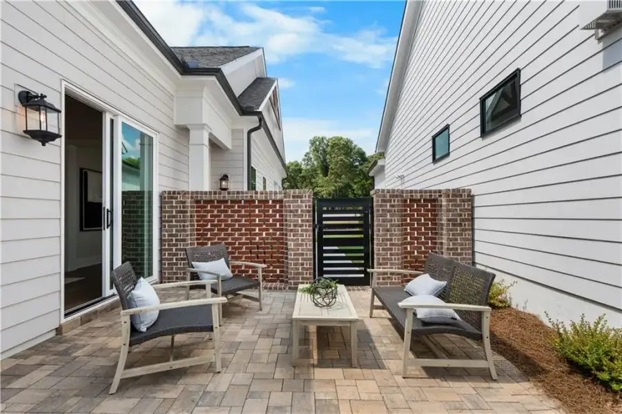 Exterior details and patio area of a home in The Villas at Aberdeen, Hoschton (Image 3).