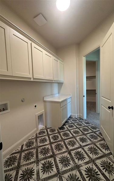 Utility room conveniently connects to primary closet