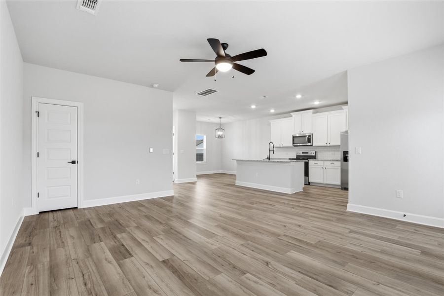 Spacious, unfurnished interior of a new home in Whisper Valley, Manor (Image 24).