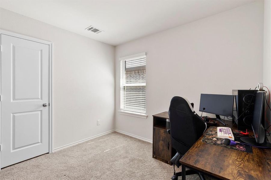 Office area featuring light carpet and baseboards Office area featuring light carpet and baseboards