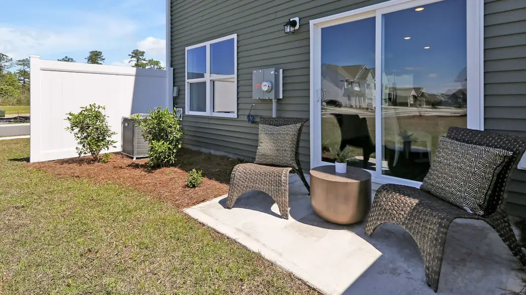Representative exterior photo of a completed home built from the MITCHELL TOWNHOME by D.R. Horton in Grayson Park Townhomes, Leland, NC (Image 2). Representative exterior photo of a completed home built from the MITCHELL TOWNHOME by D.R. Horton in Grayson Park Townhomes, Leland, NC (Image 2).