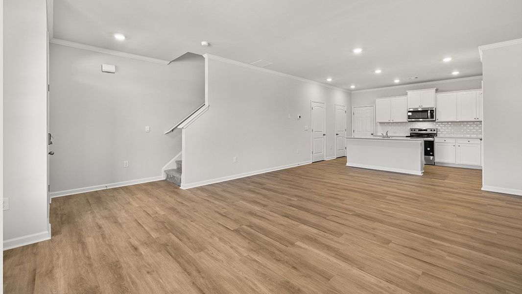 Representative unfurnished interior of a home built from the AMESBURY by D.R. Horton in Waypoint, Flowery Branch (Image 16).
