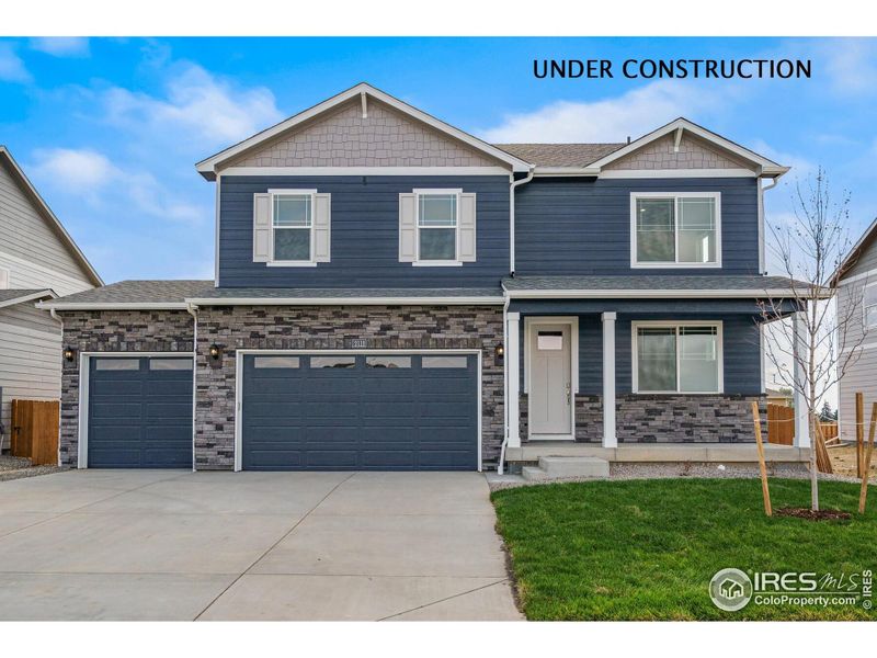 Front exterior of a new home in Hansen Farm, Fort Collins, CO, highlighting curb appeal (Image 1).