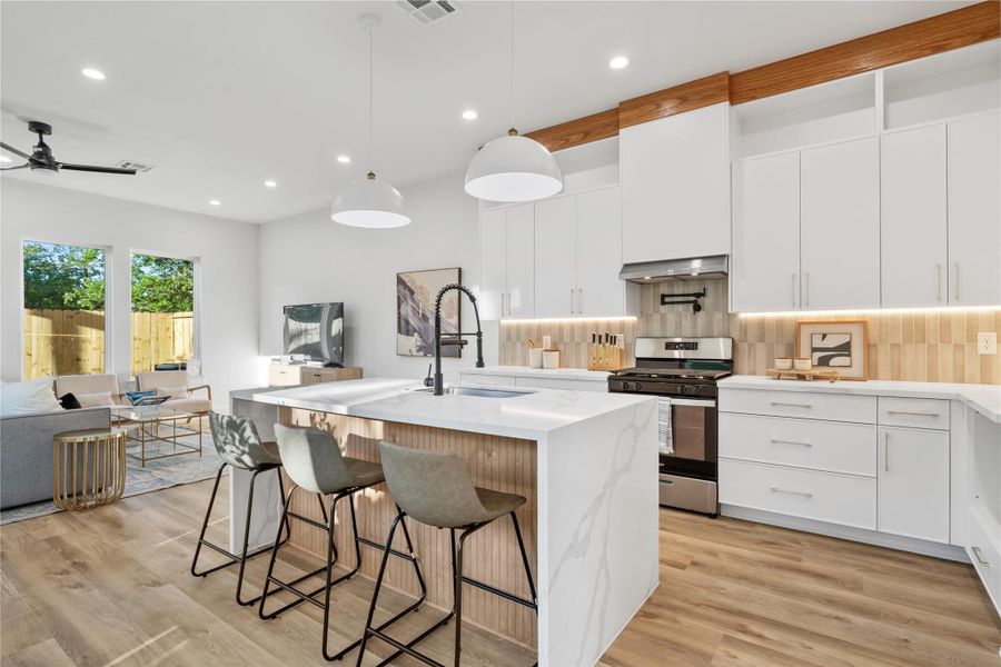 The open layout allows for effortless entertaining and connection between spaces. The open layout allows for effortless entertaining and connection between spaces.