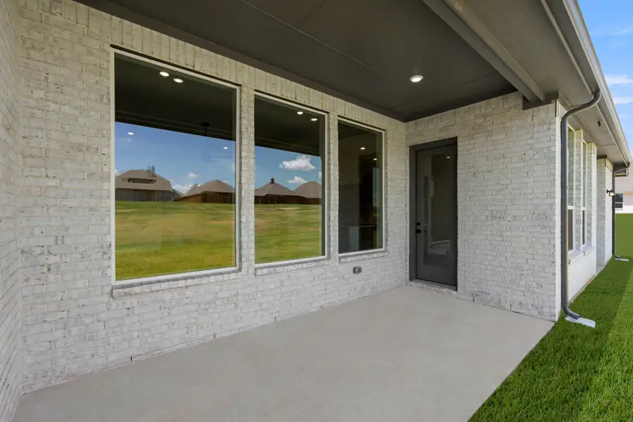 Exterior details and patio area of a home in Mockingbird Hills - Premiere Series, Joshua (Image 3). Exterior details and patio area of a home in Mockingbird Hills - Premiere Series, Joshua (Image 3).