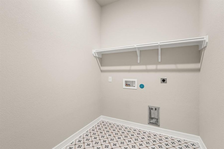 The laundry room layout is carefully planned for optimal workflow with designated areas for washing, drying, and storing.