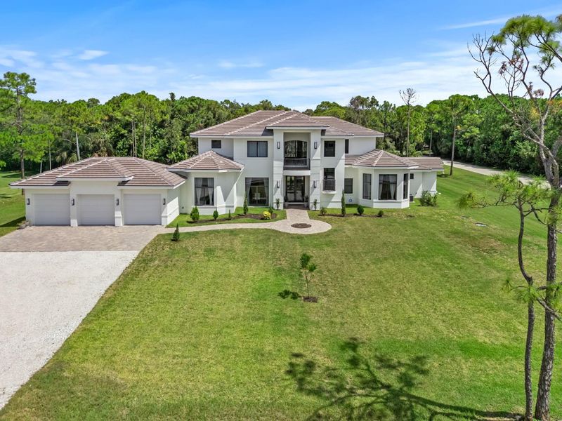 Front exterior of a new home in , Palm Beach Gardens, FL, highlighting curb appeal (Image 24).