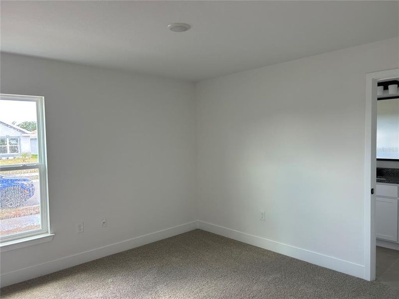 Spacious, unfurnished interior of a new home in Watercress Cove, North Port (Image 13).