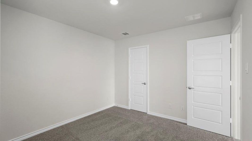 Room featuring plush gray carpet flooring, light gray wall paint, and recessed ceiling lighting
