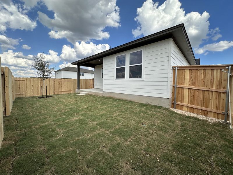 Exterior details and patio area of a home in Crosswinds, Kyle (Image 12).