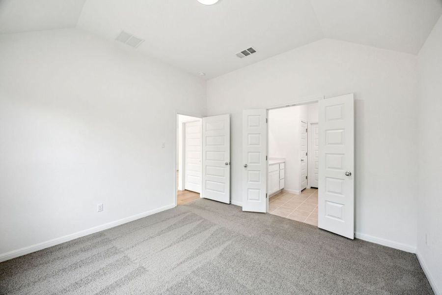 Primary Suite in the Spruce home plan by Trophy Signature Homes - REPRESENTATIVE PHOTO