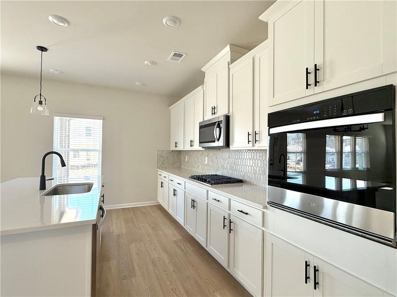 Furnished interior view inside a new home in Vines at Mill Creek - Estate Series, Braselton (Image 6).