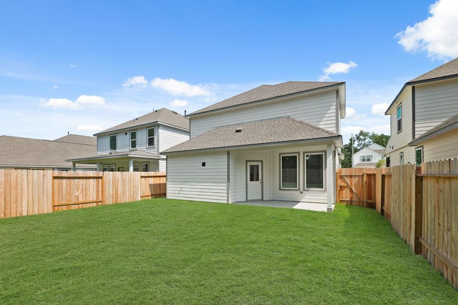 Exterior details and patio area of a home in Cypresswood Landing, Humble (Image 4).