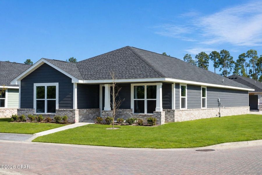 Front exterior of a new home in East Bay, Panama City, FL, highlighting curb appeal (Image 2). Front exterior of a new home in East Bay, Panama City, FL, highlighting curb appeal (Image 2).