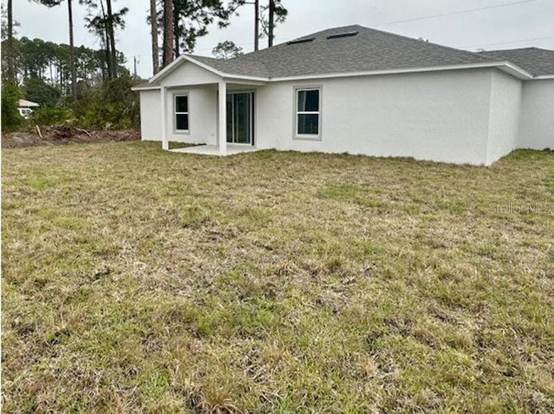 Exterior details and patio area of a home in Palm Coast, Palm Coast (Image 3).