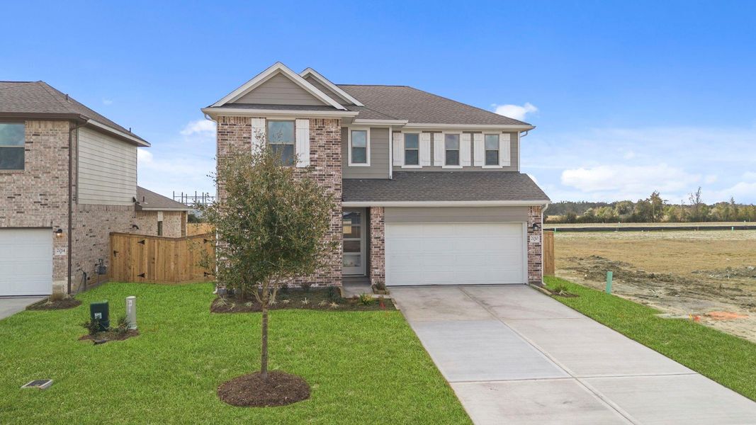 Front exterior of a new home in Windrose Green, Angleton, TX, highlighting curb appeal (Image 20).