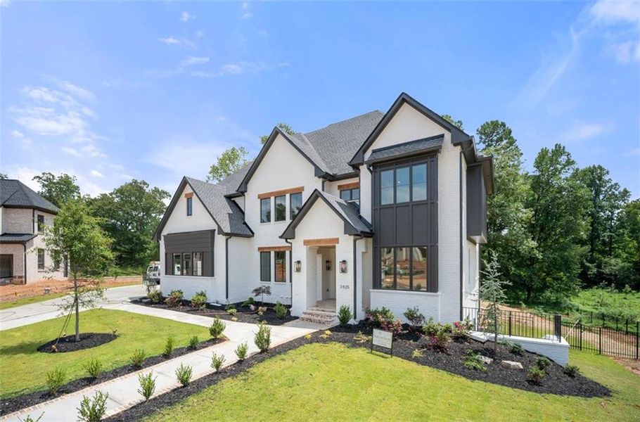 Front exterior of a new home in Timber Rock Manor, Cumming, GA, highlighting curb appeal (Image 31).