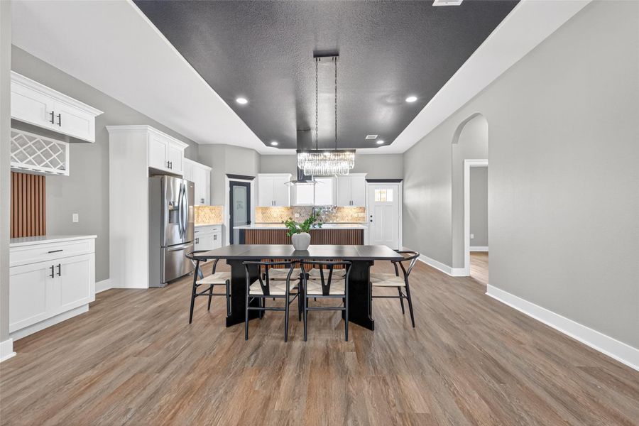 Kitchen offers generous workspace, custom cabinetry, and convenient access to the dining area. Kitchen offers generous workspace, custom cabinetry, and convenient access to the dining area.