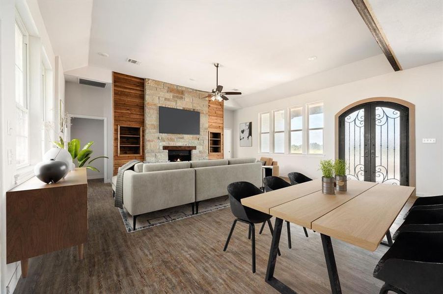 Living room with a fireplace, french doors, ceiling fan, and wood-type flooring