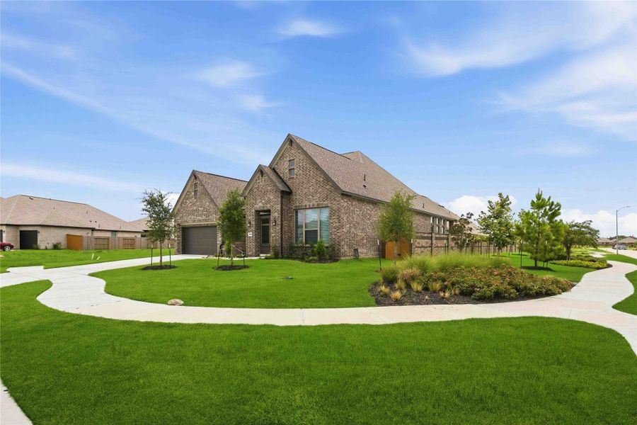 Front exterior of a new home in Canterra Creek 60', Rosharon, TX, highlighting curb appeal (Image 2). Front exterior of a new home in Canterra Creek 60', Rosharon, TX, highlighting curb appeal (Image 2).