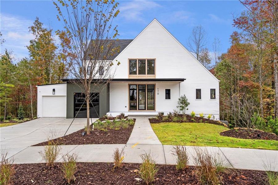 Front exterior of a new home in Aster, Roswell, GA, highlighting curb appeal (Image 1). Front exterior of a new home in Aster, Roswell, GA, highlighting curb appeal (Image 1).