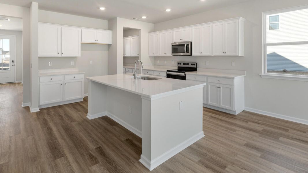 Representative furnished interior of a home built from the HARBOR OAK by D.R. Horton in Indigo Preserve, Leland (Image 9).