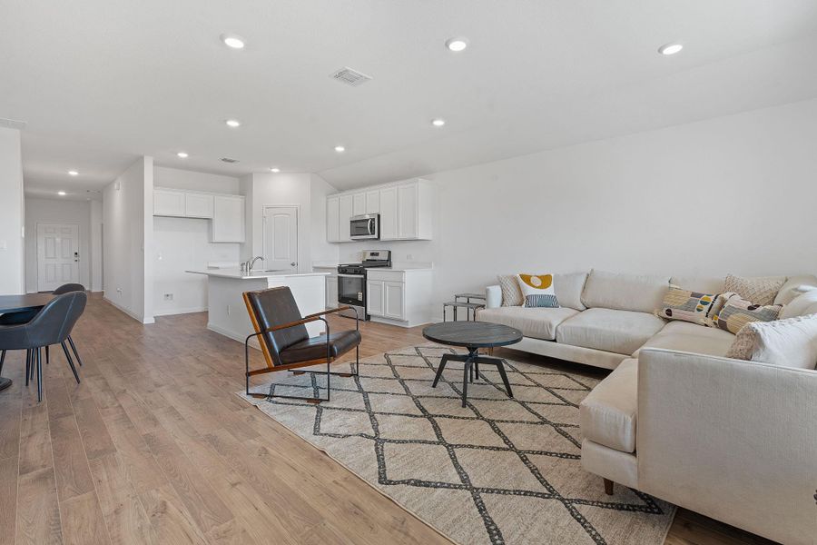 Living room featuring recessed lighting and light wood-style flooring Living room featuring recessed lighting and light wood-style flooring