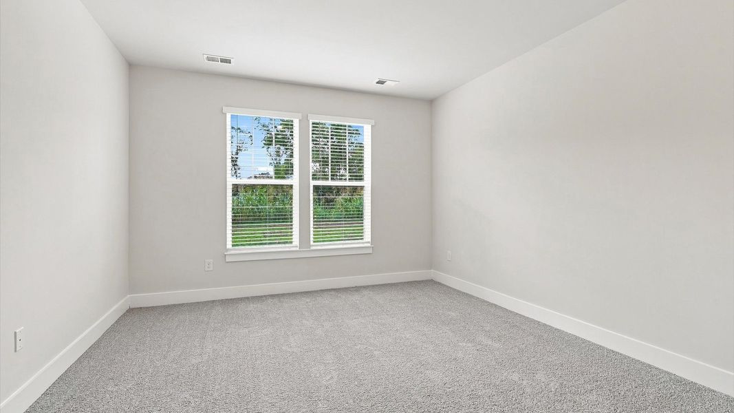 Primary suite that offers first-rate relaxation with established style and elevated finishes at Village at Midway