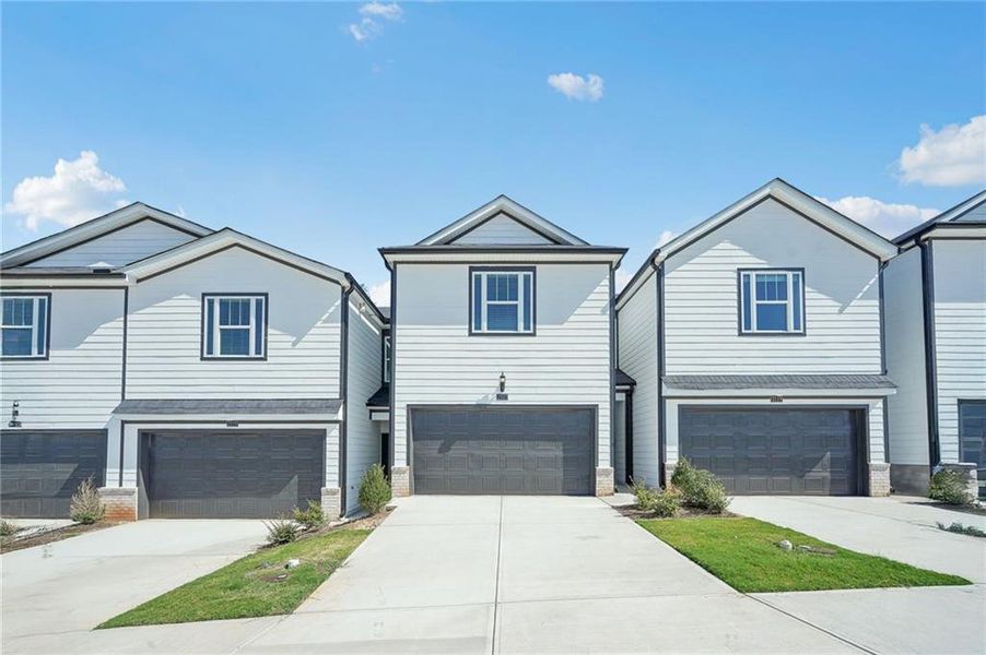 Front exterior of a new home in , Conyers, GA, highlighting curb appeal (Image 2). Front exterior of a new home in , Conyers, GA, highlighting curb appeal (Image 2).