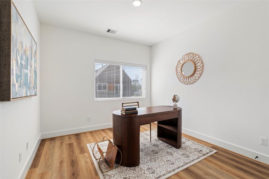 This multi-purpose secondary bedroom has been staged as an office to showcase it's versatility!