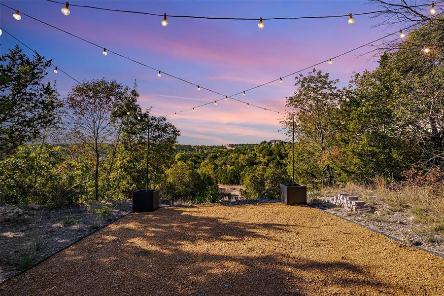 Yard at dusk featuring a patio area Yard at dusk featuring a patio area