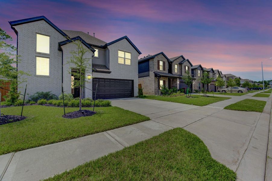 Front exterior of a new home in , Houston, TX, highlighting curb appeal (Image 21).